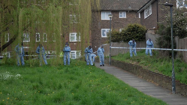 Forensic officers near the scene in Woolwich where 14-year-old Eghosa Ogbebor was shot dead 