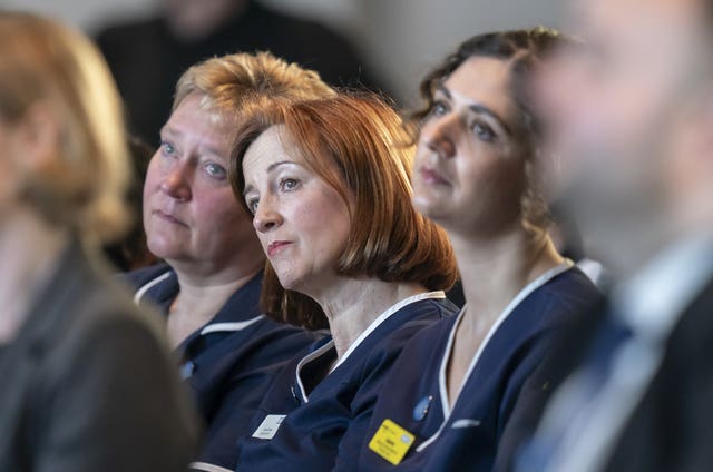 NHS staff attend a ceremony marking the fifth anniversary of the Covid-19 pandemic at the National Memorial Arboretum, in Burton-on-Trent