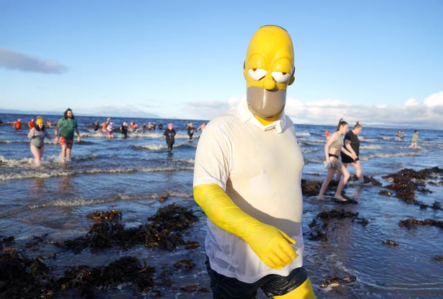 Swimmers take part in the Ayrshire Cancer Support Boxing Day Dip at Ayr Beach
