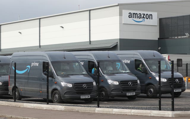 Delivery vans at a Amazon warehouse