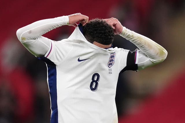 Jude Bellingham pulls his shirt over his face after England lost to Greece at Wembley