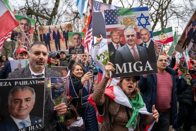 People take part in a rally held outside the US consulate in Edinburgh