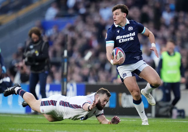 Scotland’s Ben White with ball in hand before scoring a try against England