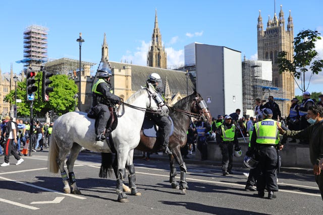 Mounted police watch over protesters in Parliament Square last weekend