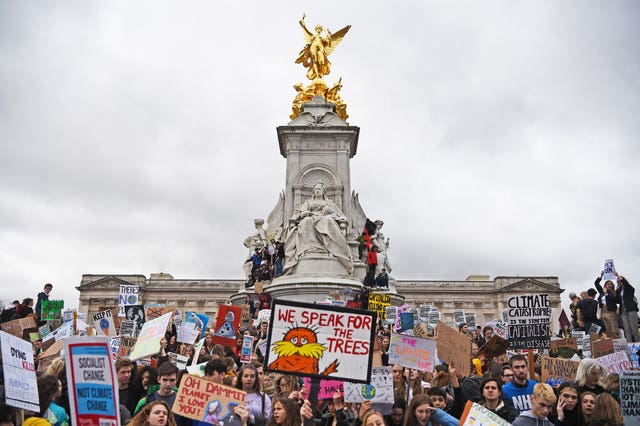 Police warned people taking part in the protests not to climb statues (Kirsty O'Connor/PA)