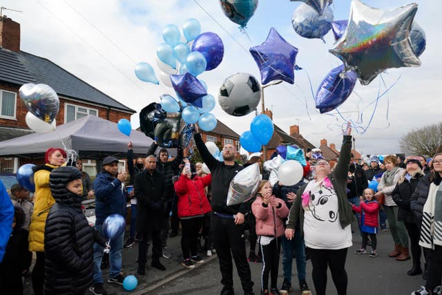People release balloons during a tribute to six-year-old Arthur Labinjo-Hughes outside Emma Tustin’s former address in Solihull