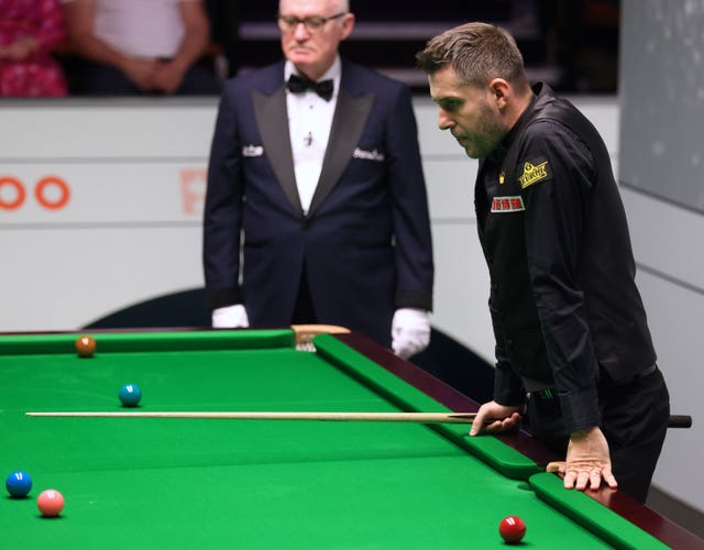 Mark Selby considers his options