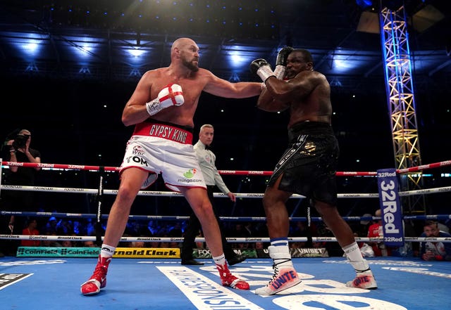 Tyson Fury (left) said he had retired after beating Dillian Whyte