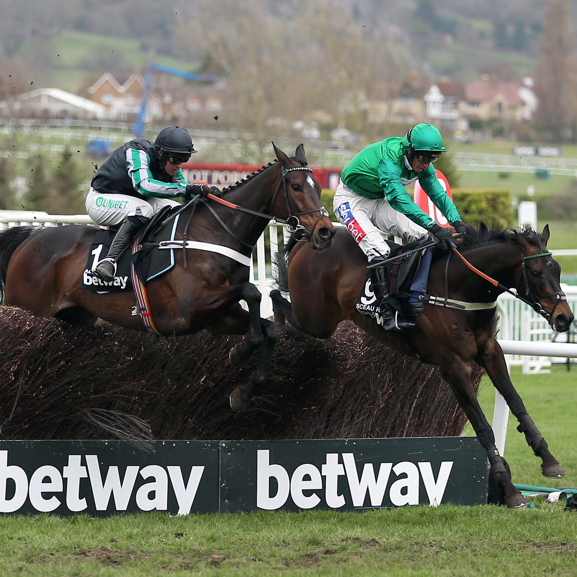 Altior (left) jumps the last in second behind Sceau Royal