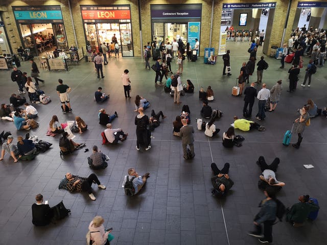 People waiting inside King's Cross station
