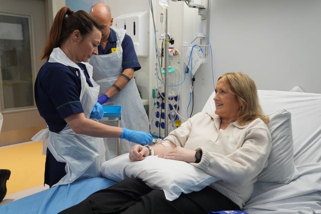 Senior clinical practice facilitator Nicole Prescott administers breakthrough treatment to patient Katie Tinkler