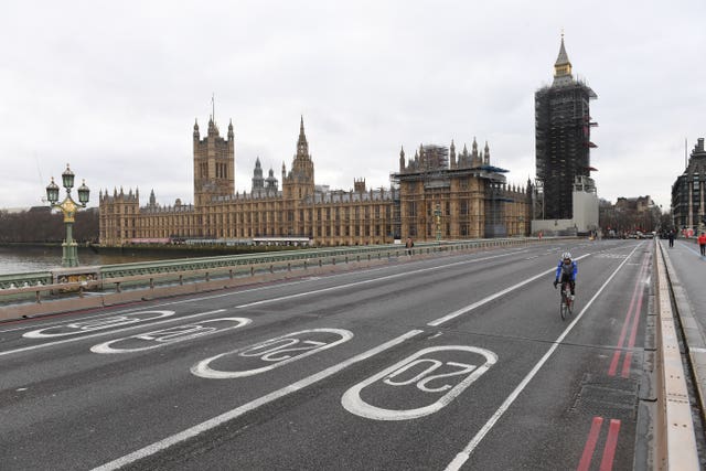 A quiet Westminster Bridge in London, where people have been advised against all but essential trave