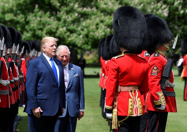 Then-US President Donald Trump and then-Prince of Wales inspecting the Guard of Honour during a Ceremonial Welcome at Buckingham Palace in 2019 