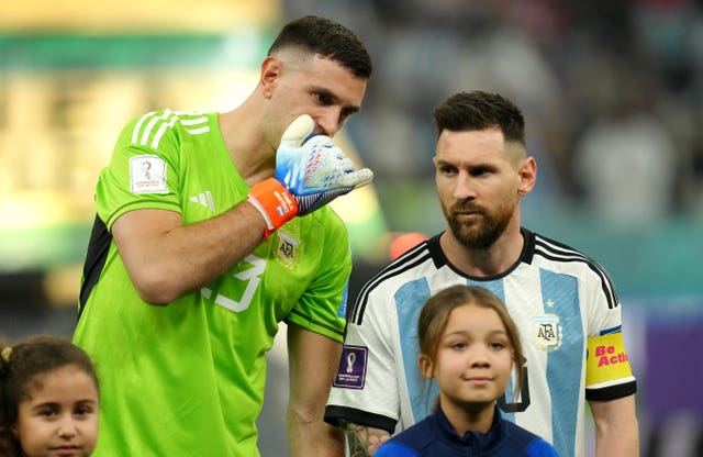 Emiliano Martinez, left, speaks to Lionel Messi before the World Cup semi-final