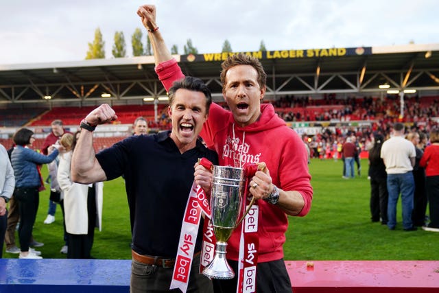 Wrexham co-owners Ryan Reynolds (right) and Rob McElhenney celebrate their promotion to the Championship