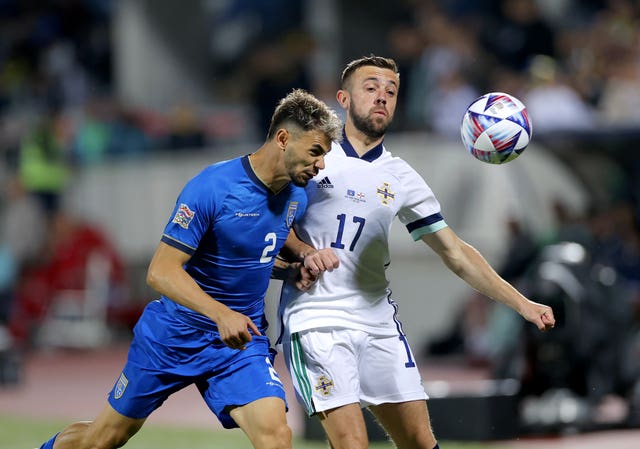 Conor McMenamin (right) in action for Northern Ireland away to Kosovo