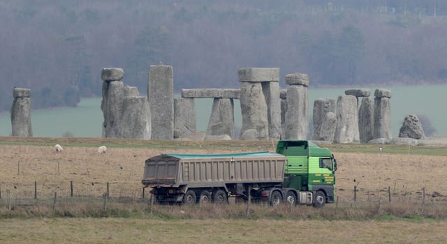 Traffic passing Stonehenge on the A303 road in Wiltshire
