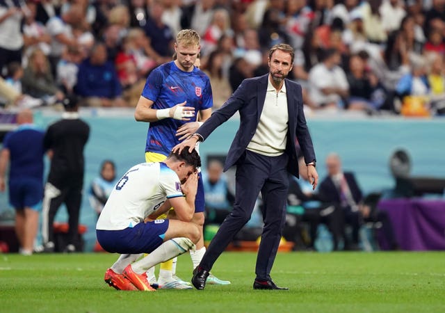 England’s Harry Maguire is consoled by manager Gareth Southgate