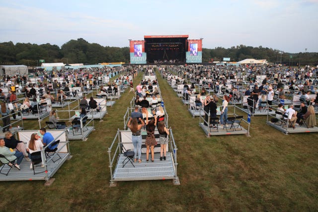 People during the Sam Fender concert at the Virgin Money Unity Arena, a pop-up venue in Gosforth Park, Newcastle. Fans in groups of up to five people are watching the show from 500 separate raised metal platforms at what the promoters say is the world’s first socially distanced gig