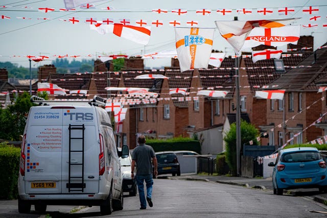 England flags hang across the street in Torrington Avenue, Knowe, Bristol (Ben Birchall/PA)