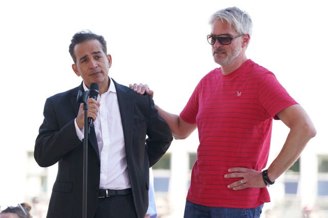 Grace O’Malley Kumar and Barnaby Webber’s fathers speaking during a vigil