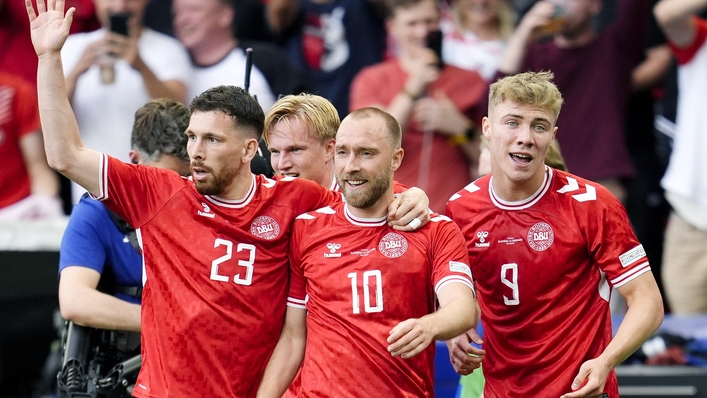 Christian Eriksen, centre, celebrates with team-mates after scoring Denmark’s opener (Nick Potts/PA)