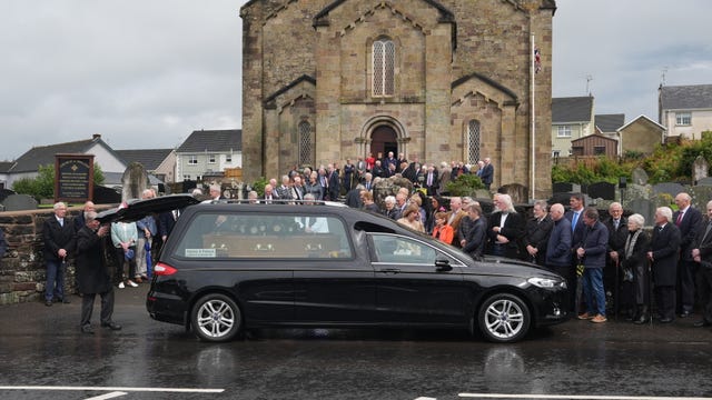 The coffin of country music star Derrick Mehaffey arrives at Donacavey Church of Ireland Parish Church