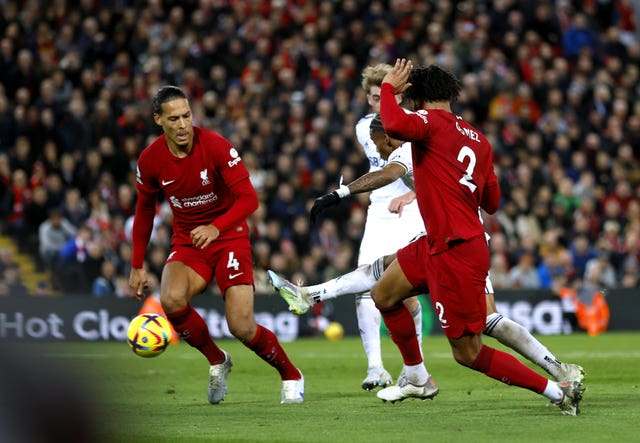 Crysencio Summerville, partially obscured, scores Leeds' winner at Anfield