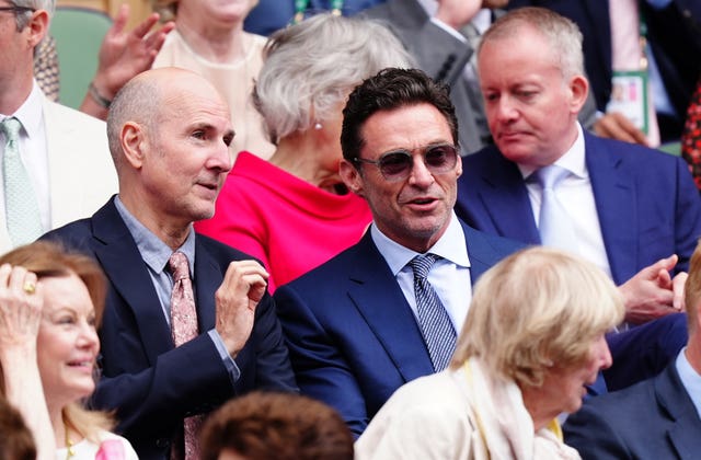 Hugh Jackman and Ian Rickson in the royal box on day thirteen of the 2024 Wimbledon Championships at the All England Lawn Tennis and Croquet Club