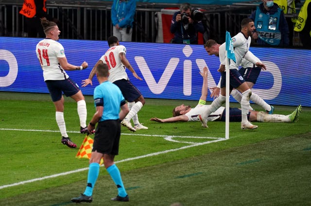 Harry Kane, 3rd right, celebrates his goal against Denmark with his England team-mates