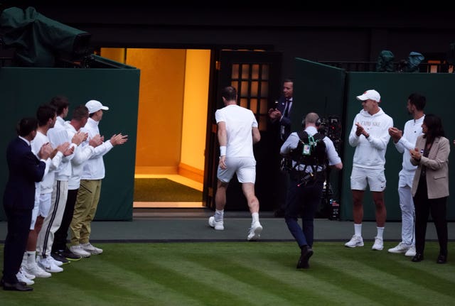 Andy Murray is applauded off Centre Court