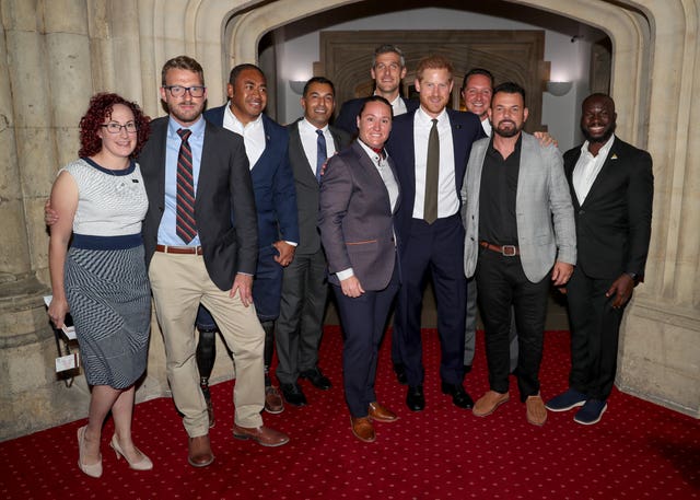 The Duke of Sussex with Invictus staff and competitors during a reception to celebrate the fifth anniversary of the Invictus Games at the Guildhall in central London 