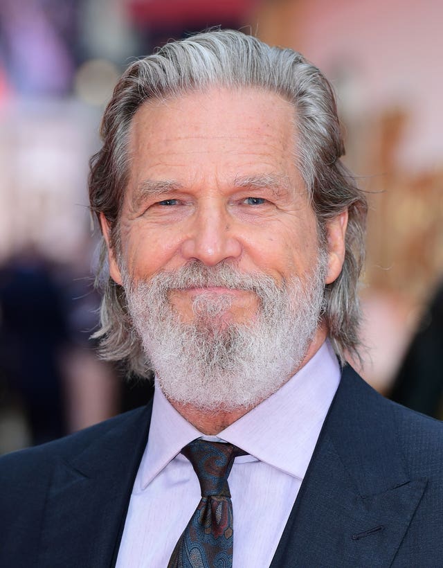 Head shot of a man with grey hair and a grey beard