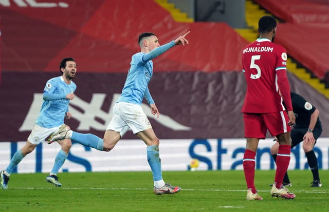 Manchester City's Phil Foden celebrates scoring at Anfield