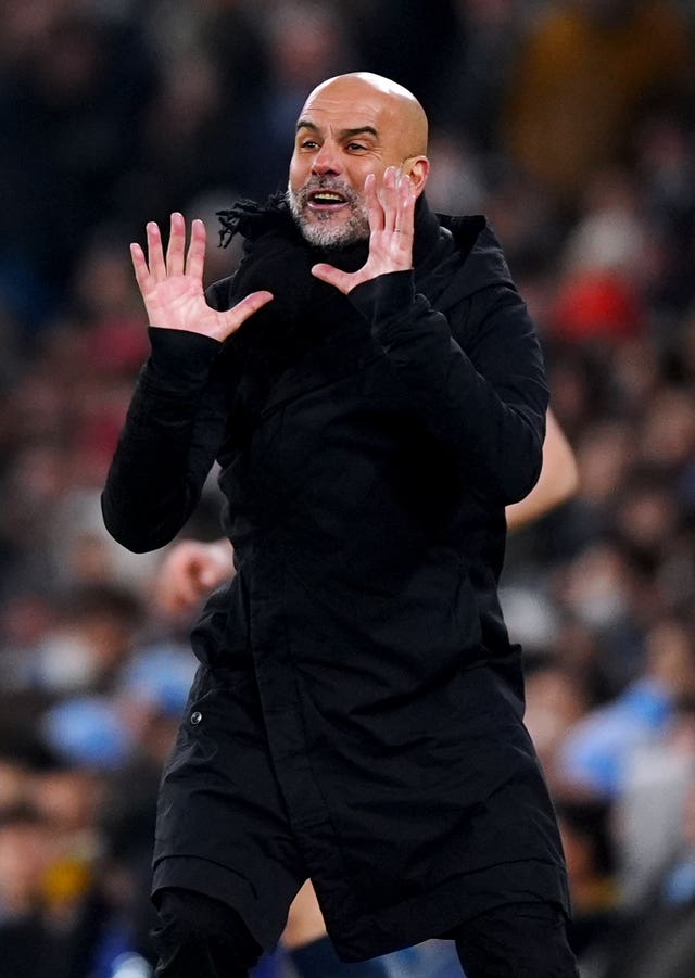 Manchester City manager Pep Guardiola gestures on the touchline during a game