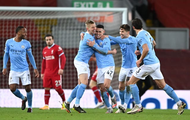Manchester City celebrate a goal at Anfield