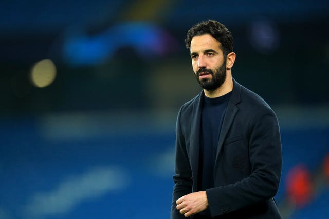 Sporting Lisbon boss Ruben Amorim walks across the pitch