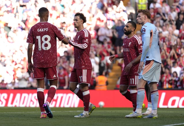 Curtis Jones, centre, celebrates