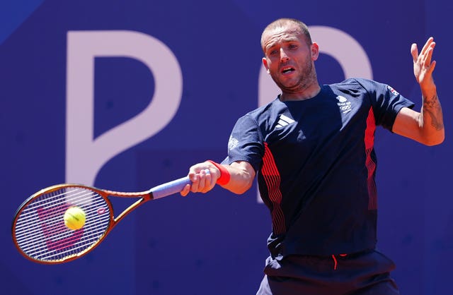 Dan Evans hits a forehand 