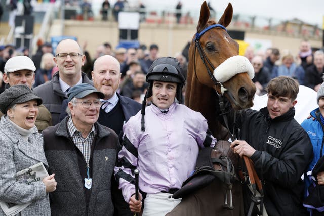 Maximilian and jockey Brian Hughes with winning owners