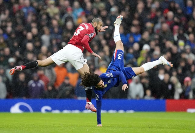 Manchester United’s Noussair Mazraoui battles for the ball