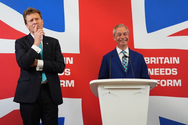 Leader of Reform UK Nigel Farage (right) and Richard Tice announce their party’s economic policy during a press conference at Church House in London