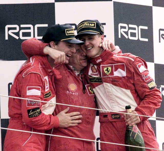 Jean Todt, centre, and Michael Schumacher, right