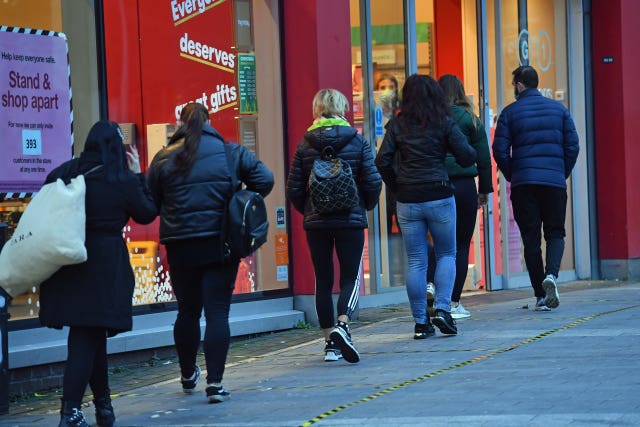 People queueing outside T.K.Maxx in Birmingham on the first day shops re-open (Jacob King/PA)