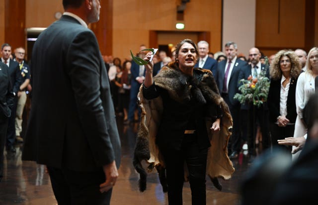 Australian senator Lidia Thorpe protests during the ceremonial welcome to Australia for the King