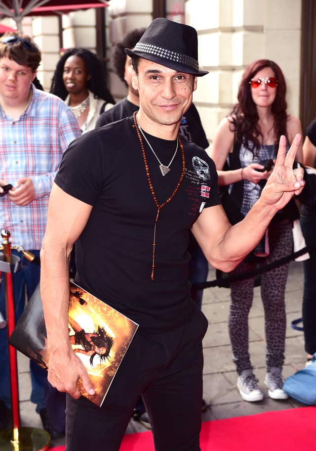 Chico making a peace sign during a red carpet event in 2016