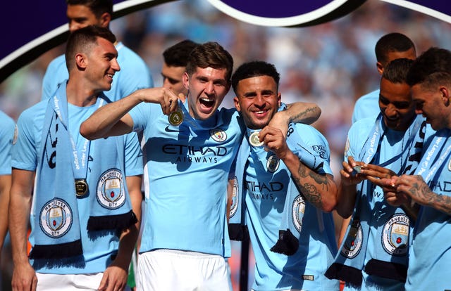 John Stones and Kyle Walker celebrate their first league title