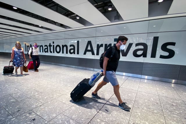Passengers in the arrivals hall at Heathrow Airport