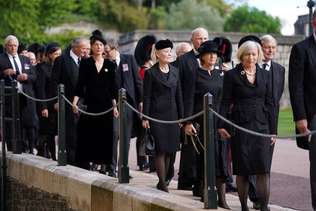 Mourners arrive for the Committal Service for Queen Elizabeth II held at St George’s Chapel in Windsor Castle, Berkshire