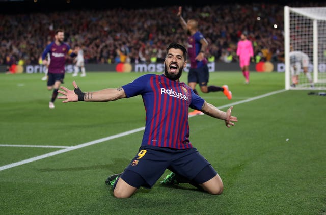 Luis Suarez celebrates scoring Barcelona's opener 